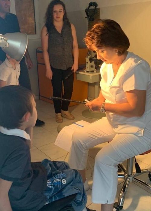 Doctor examining a child during a VIVA regional healthcare programme in Armenia
