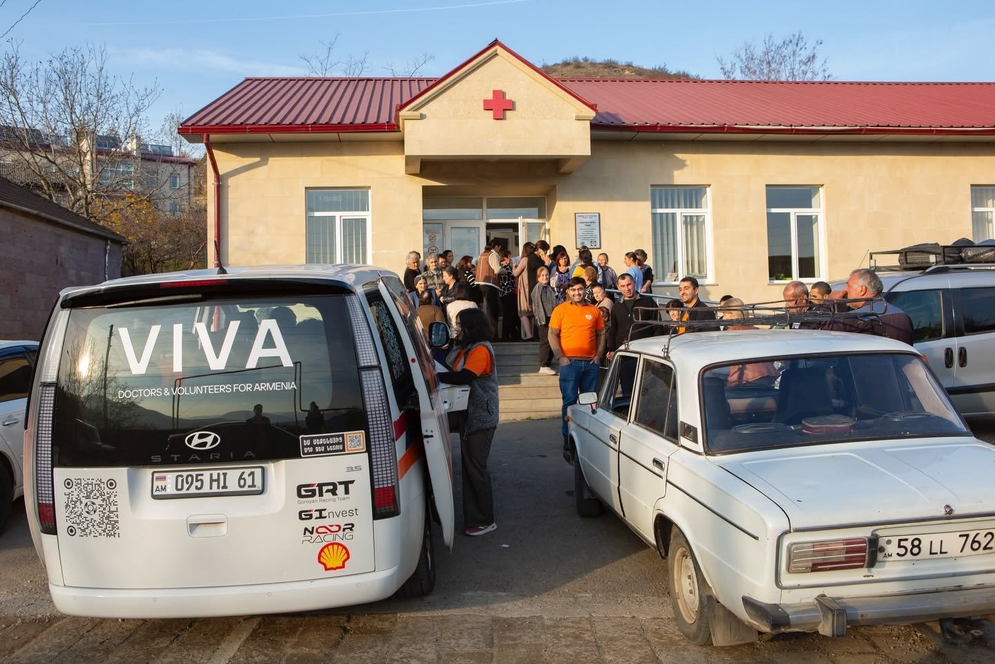 VIVA outreach vehicles and community members outside a regional clinic in Armenia