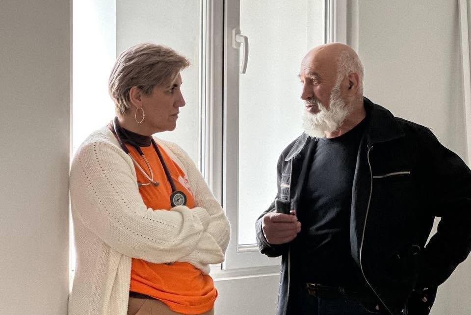 VIVA volunteer doctor consulting with an older man during a regional healthcare visit