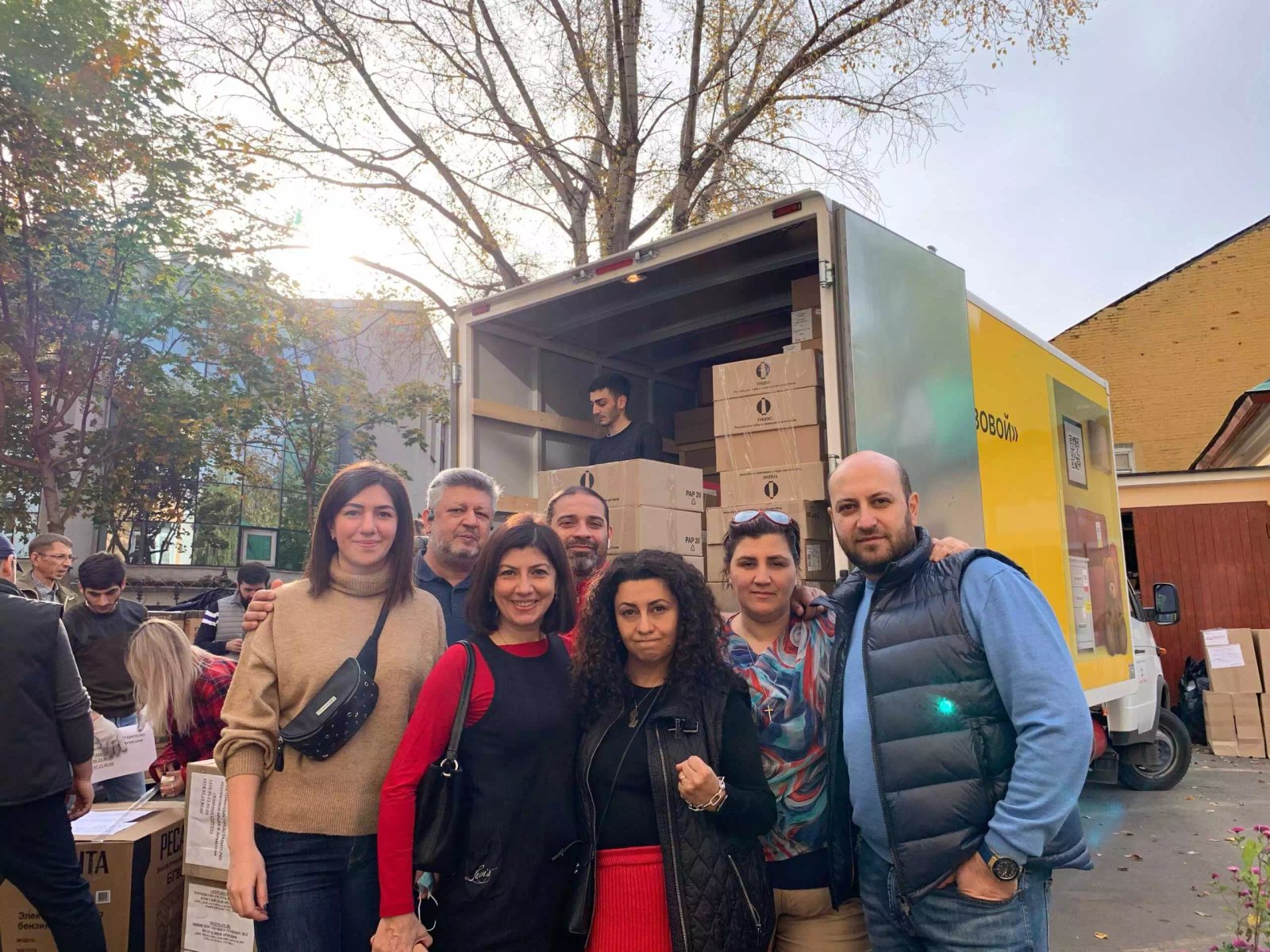 VIVA Foundation team beside a truck loaded with humanitarian aid supplies